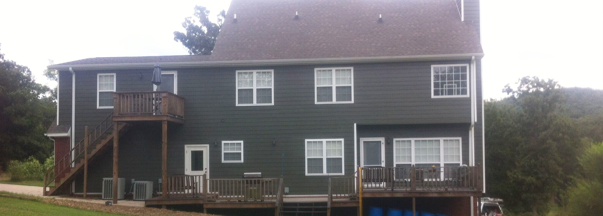 Exterior house painting by CertaPro painters in Fayetteville, AR